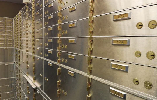 Row of secure metal boxes with gold locks, symbolizing safe and secure storage for valuable items
