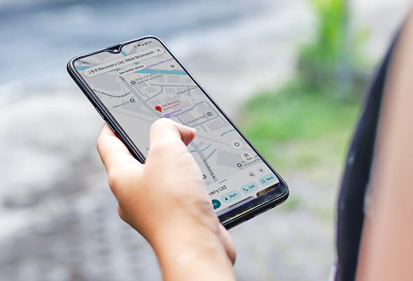 Mobile phone showing directions to StoneX JBR Recovery Ltd, helping visitors plan their site visit or delivery.