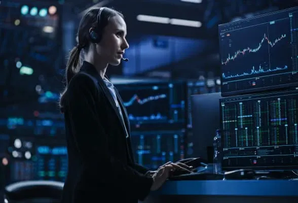 Trader using advanced platforms with multiple screens, representing institutional-grade FX technology solutions for family offices.